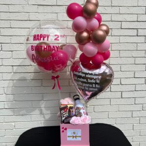 pink kids gift basket with soap roses, balloons, candy and gifts.